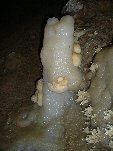 Multicolored stalagmite and crystals
